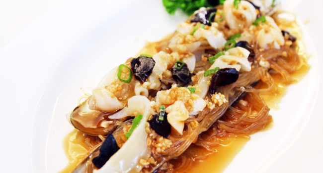 steamed bamboo clam with black garlic and glass noodles